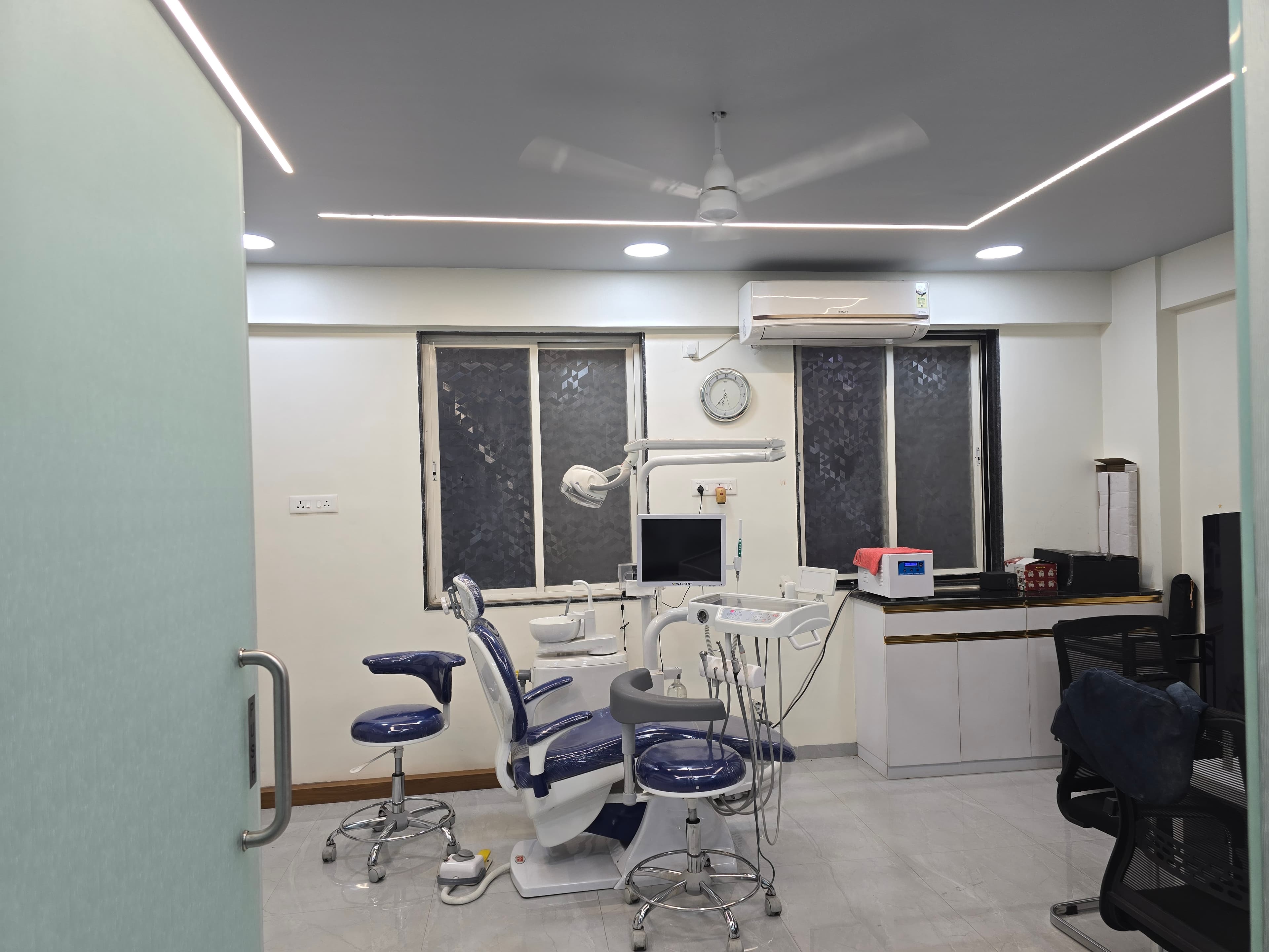 Dental treatment room with modern equipment at Sampurna Dental Care